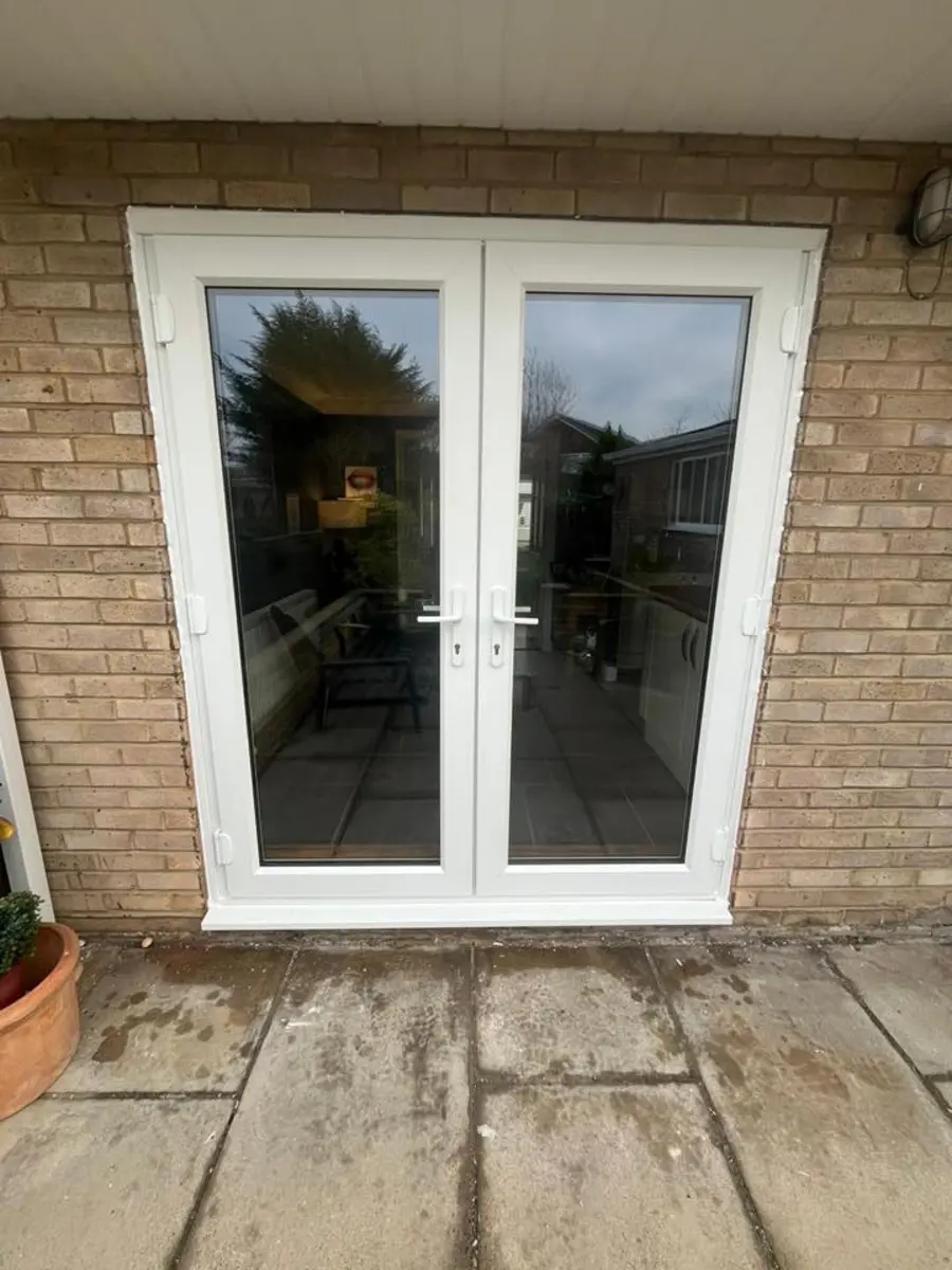 Blue composite front door with arched glass