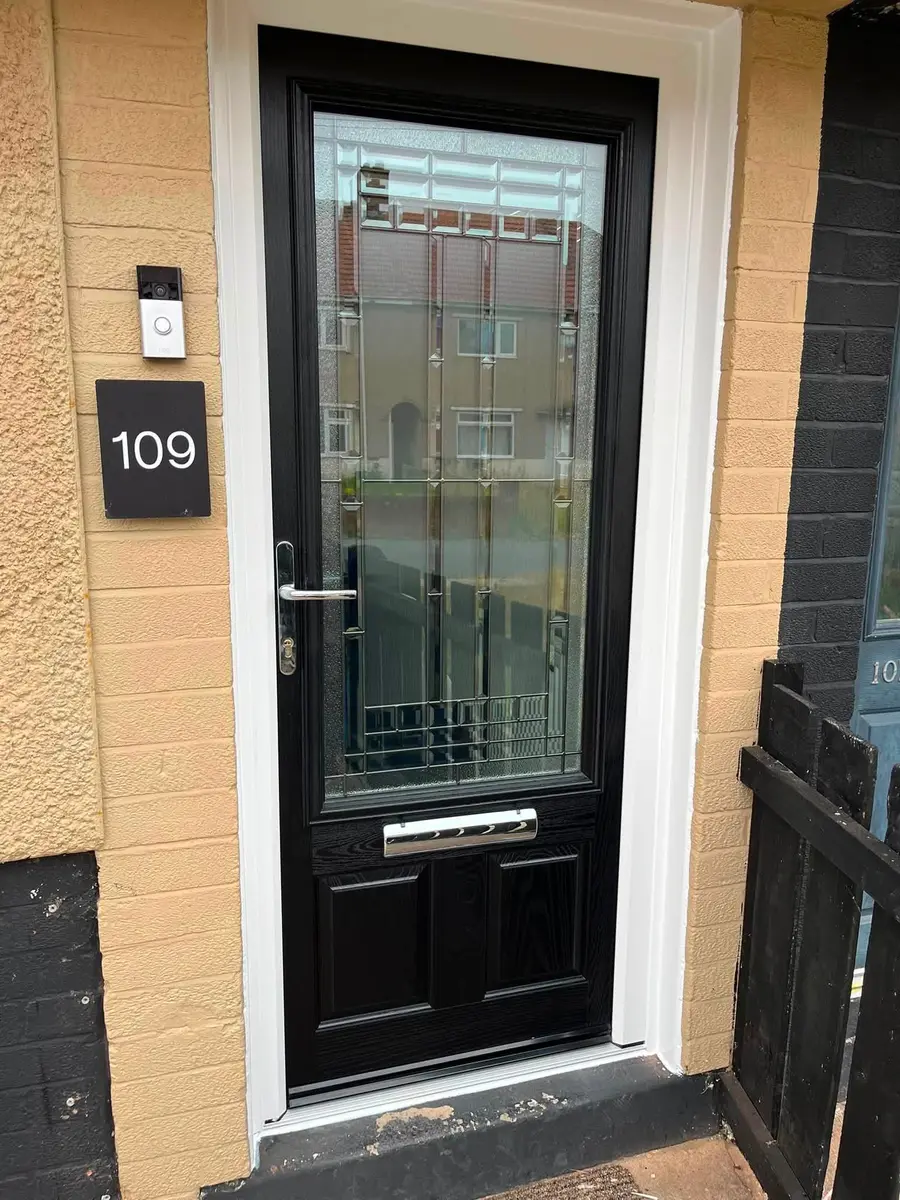 Black composite entrance door with decorative glass