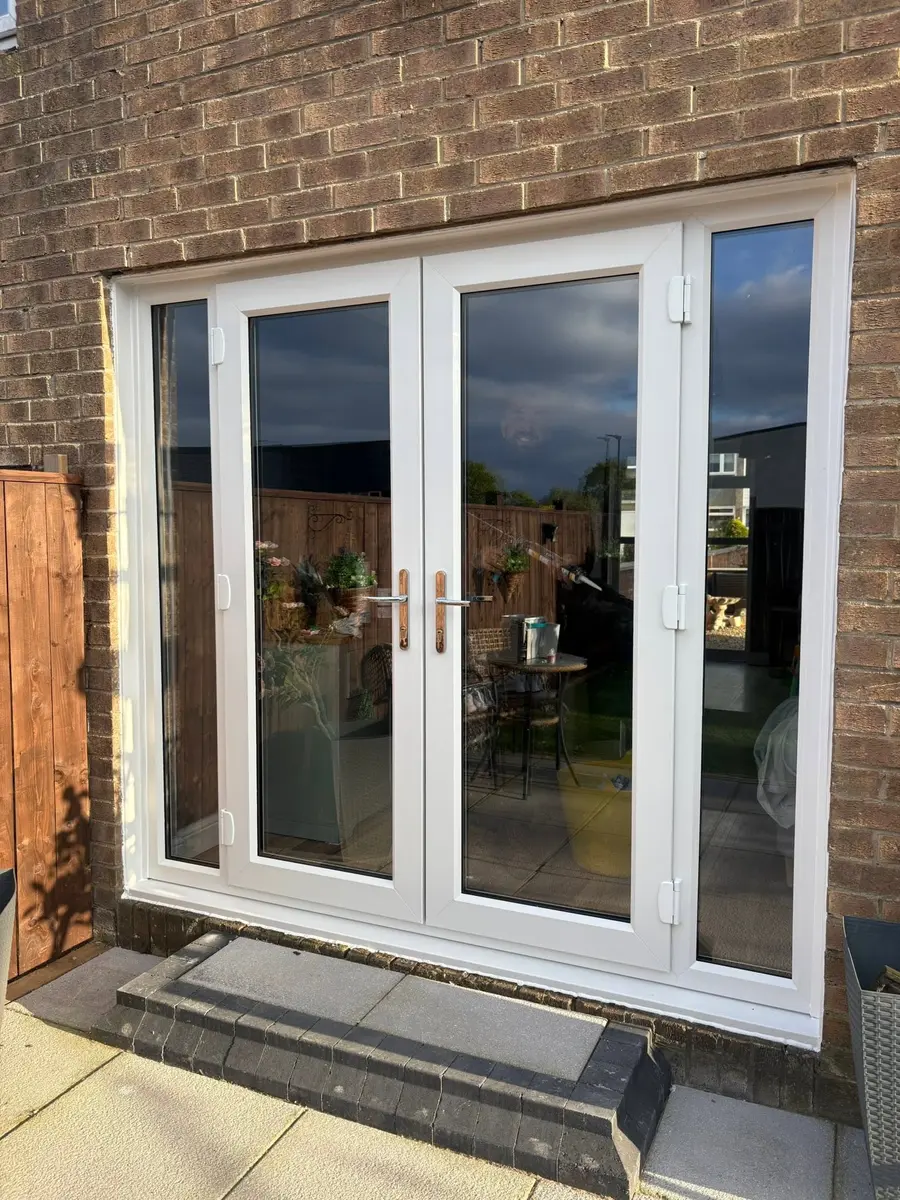 White French doors fitted in a brick property