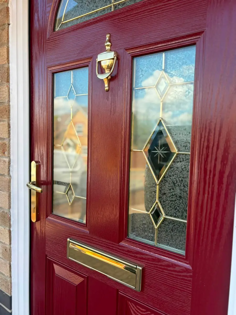 Red composite door with decorative glass
