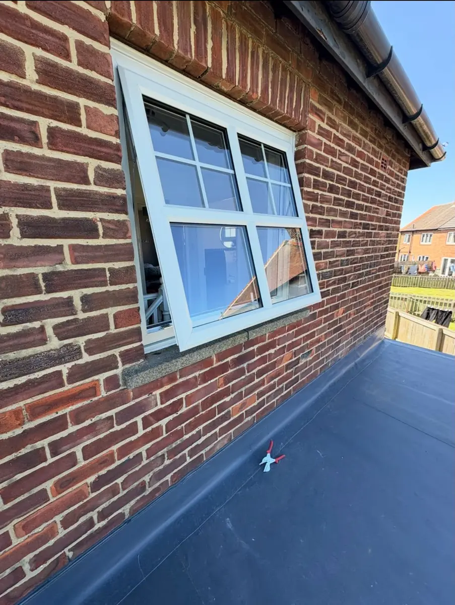 White window with golden oak exterior finish