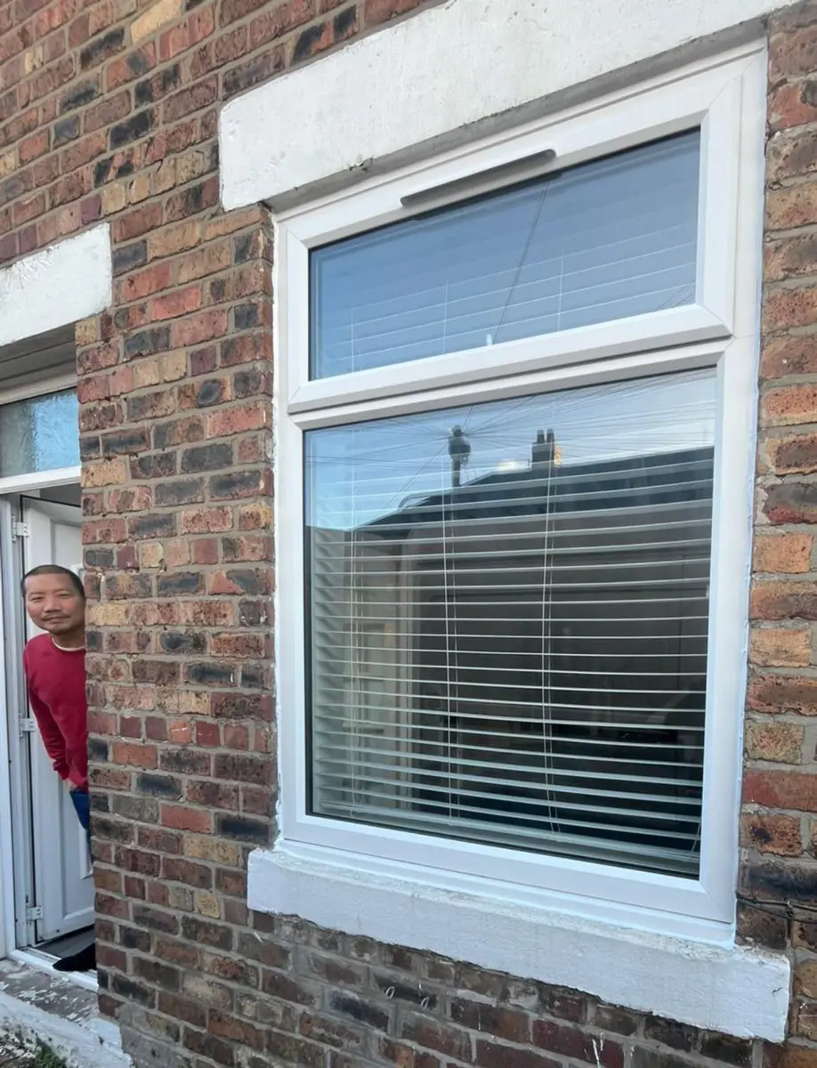 White windows and black composite door installation